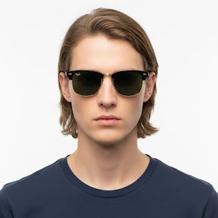 Rayban sunglasses worn by a young man with medium-length hair and a navy blue shirt.